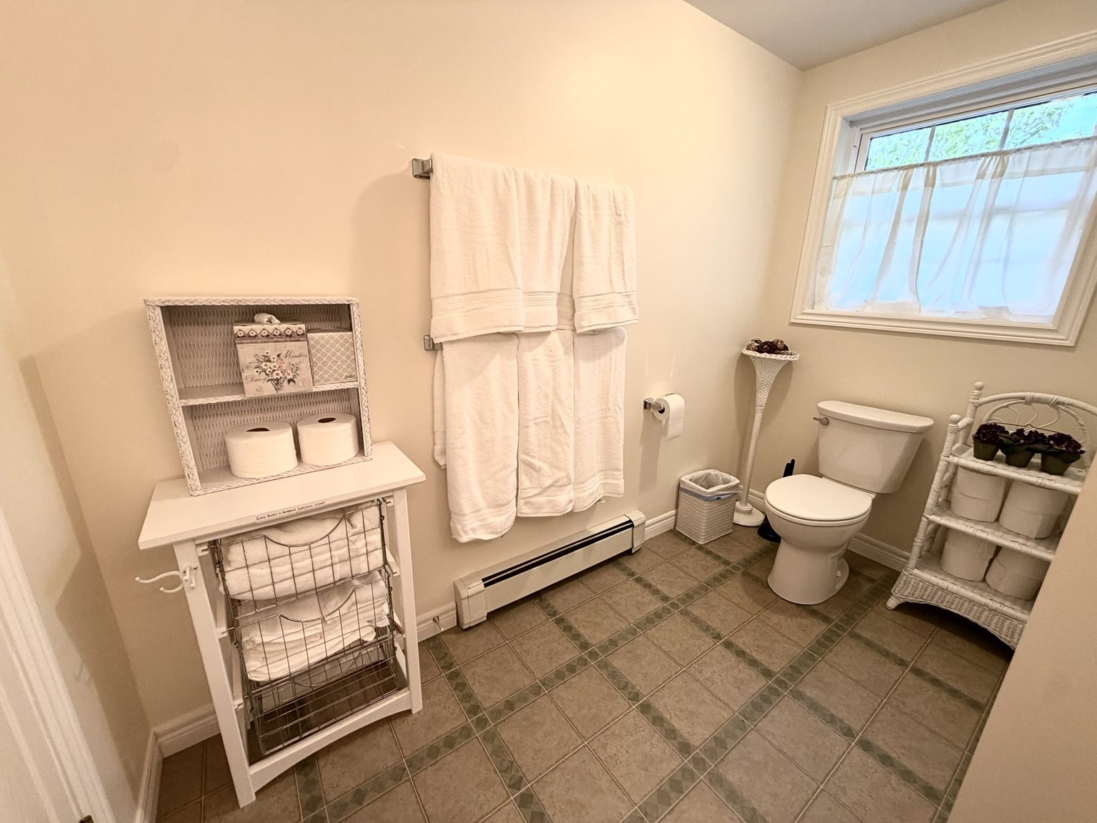Bathroom towels and storage at Ledge & Tide
