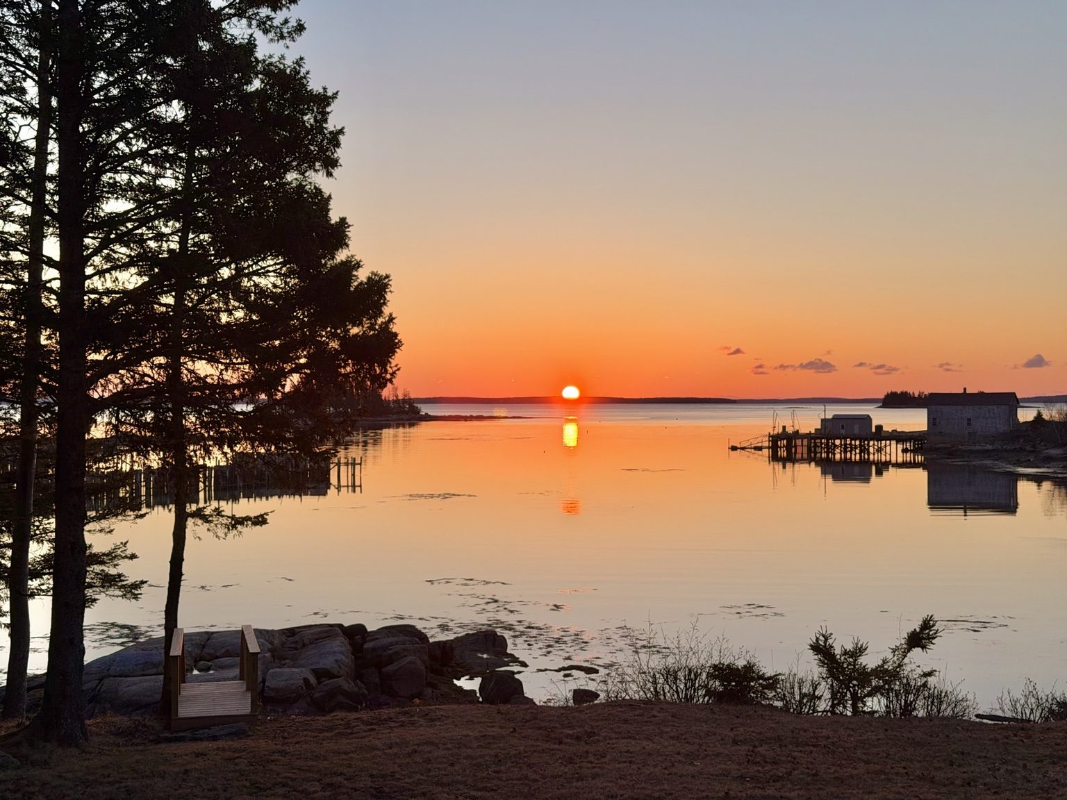 Sunrise view over the water at Ledge & Tide