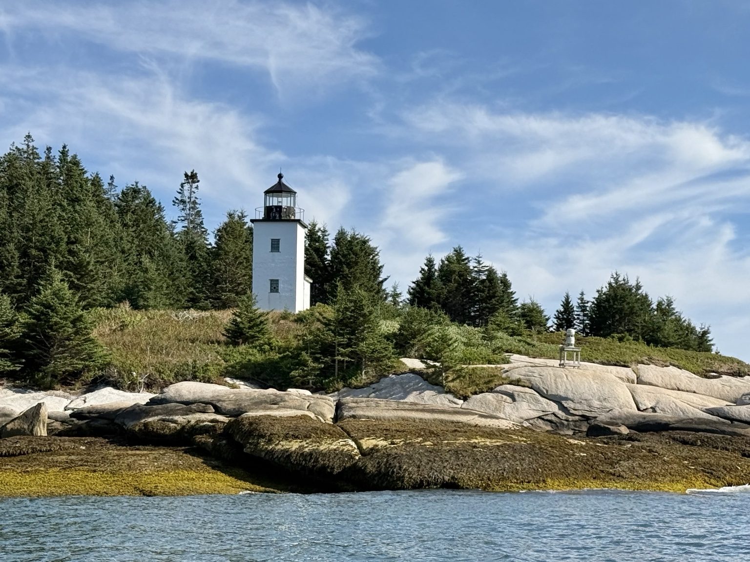 Lighthouse on a rocky shoreline near Deer Isle