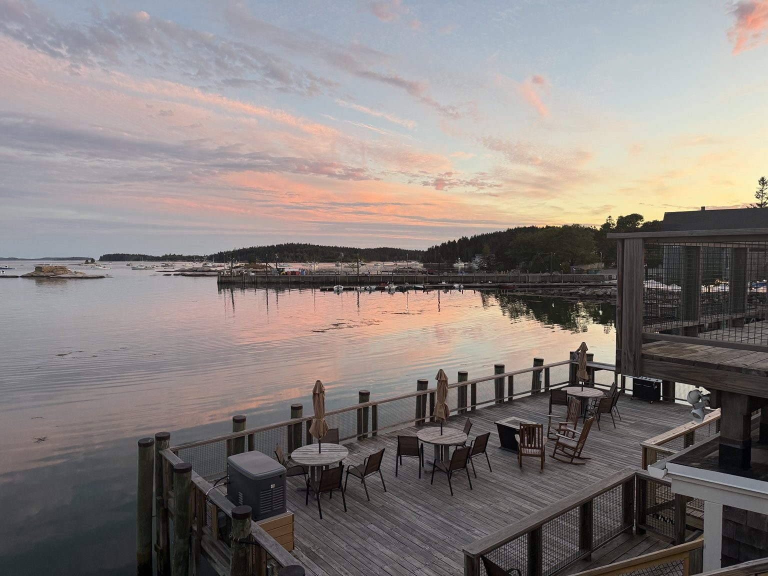 Sunset waterfront deck scene near Stonington on Deer Isle