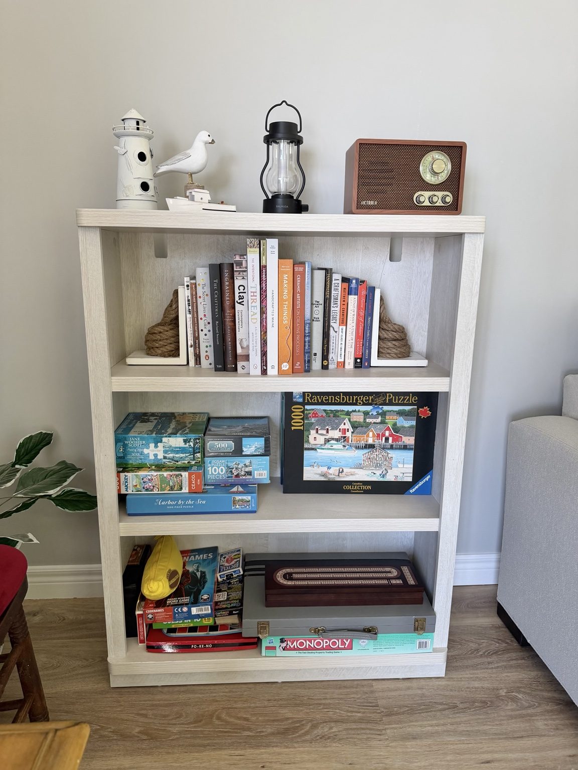 Living room games and book shelf at Ledge & Tide