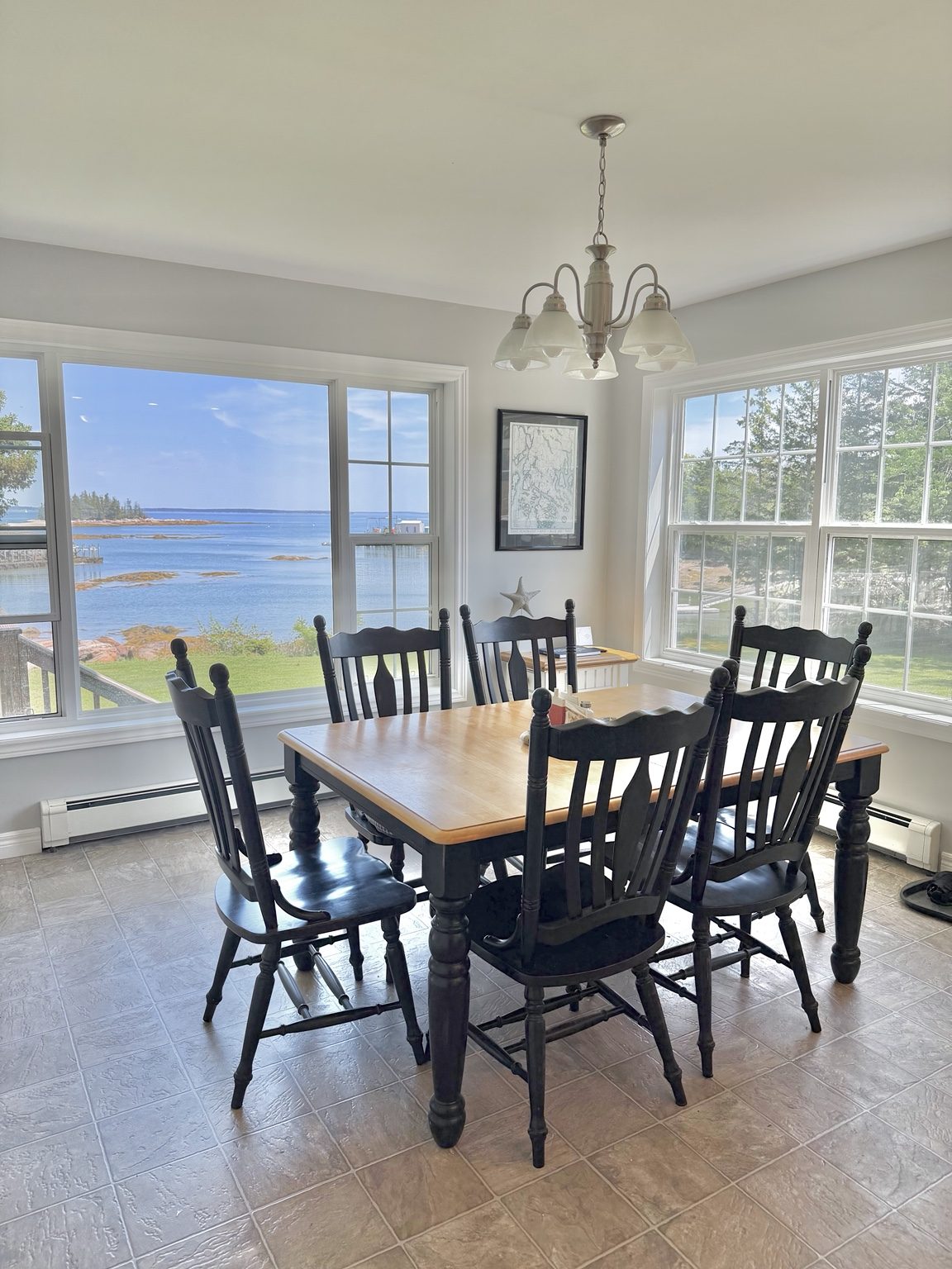 Dining room with water view at Ledge & Tide